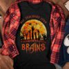 Funny Halloween zombie teacher shirt with brains design, spooky school costume gift for educators.